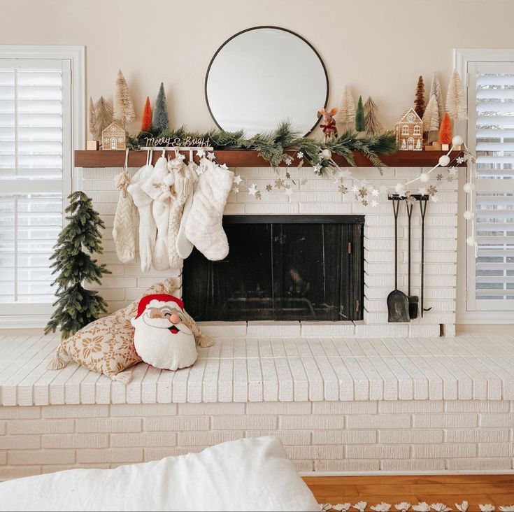 a living room with a fireplace decorated for christmas