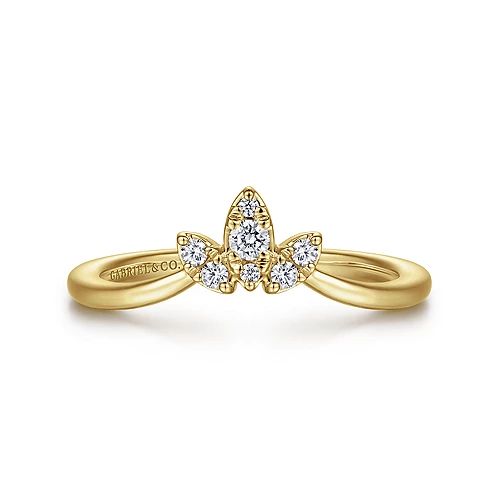 a yellow gold ring with three diamonds on it