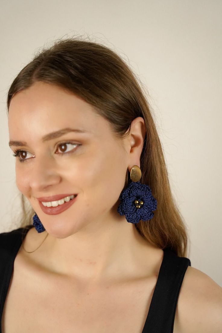 Our signature design-but grand! Awaken your inner Goddess with a stunning pair of hand-crocheted flower earrings in a chic deep blue color. Please note: Small variations in size and shape are expected; these are handcrafted items. Colors may show differently in different screens and lighting. The second model photo is for SIZE reference only, With every purchase, you support postpartum moms and babies in need in the USA. Real gold plated brass posts Design crocheted by hand in the USA Gold-plate Handmade Chic Flower Earrings, Blue Elegant Earrings With 3d Flowers, Elegant Blue Earrings With 3d Flowers, Elegant Blue 3d Flower Earrings, Blue 3d Flower Drop Earrings, Blue 3d Flowers Earrings, Blue Bohemian Flower Earrings For Party, Blue Handmade Flower-shaped Earrings, Blue Handmade Flower Earrings