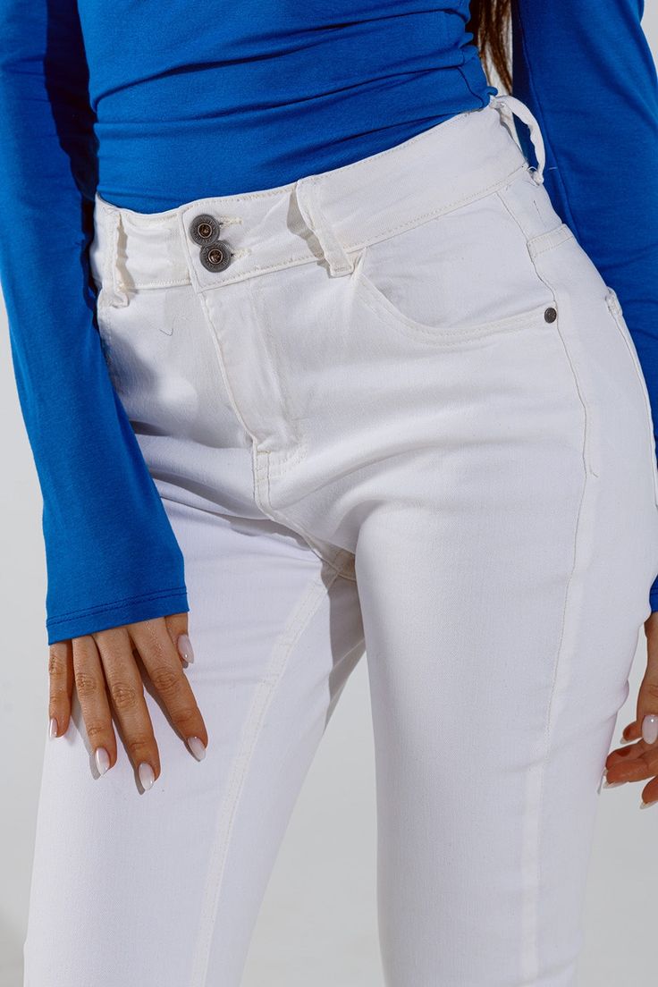 Elevate your denim collection with our Skinny Flared Jeans in White, perfect for any season. These jeans feature a double button detail and flared legs, providing a stylish and flattering silhouette. Made from a blend of 98% cotton and 2% elastane, they offer a comfortable stretch and a skinny fit. The regular waist and full length make them a versatile choice for any occasion. Pair them with your favorite top and accessories for a chic and timeless look. Model Info: Model is wearing size S. Mod Tan Scarf, Types Of Jeans, Jeans Jumpsuit, Flared Jeans, Large White, Button Detail, Hat Hairstyles, Short Pants, Jeans Pants