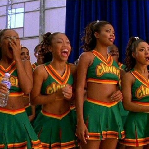 the cheerleaders are singing and laughing together