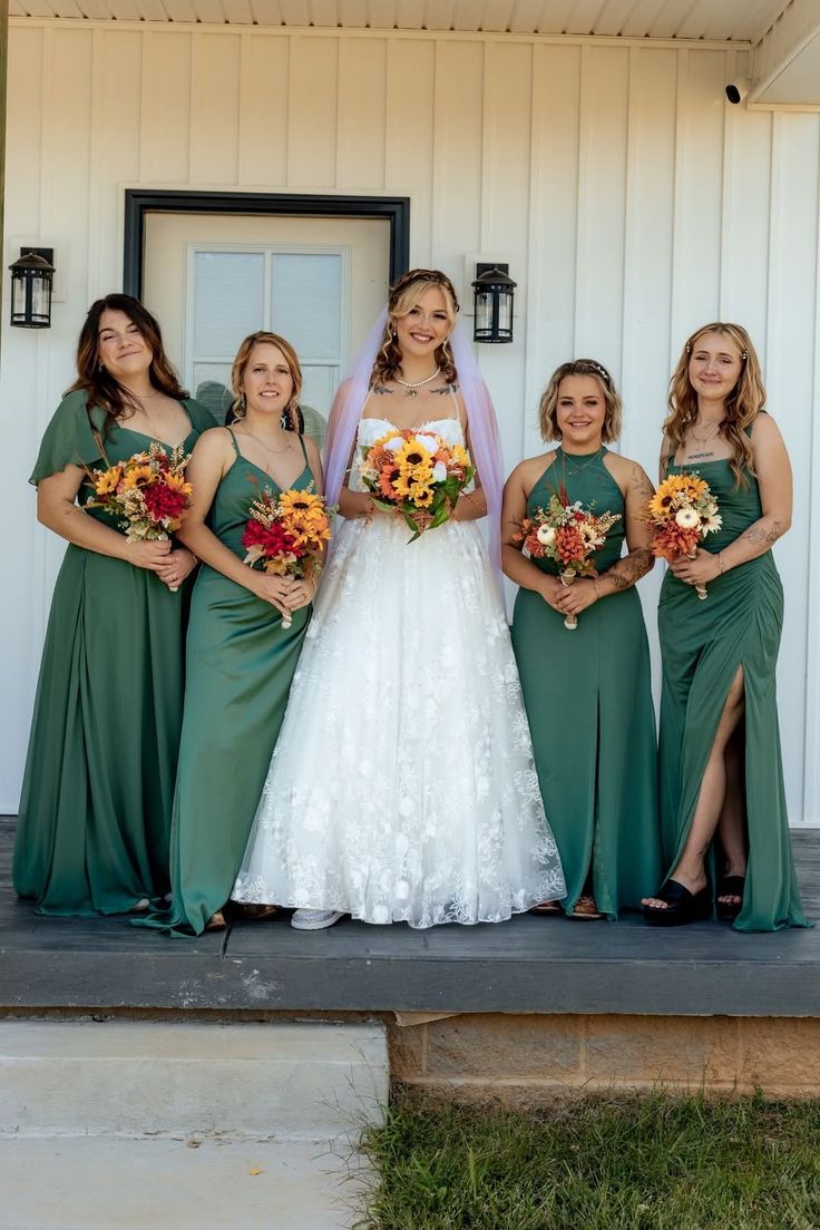 a bride and her bridesmaids pose for a photo