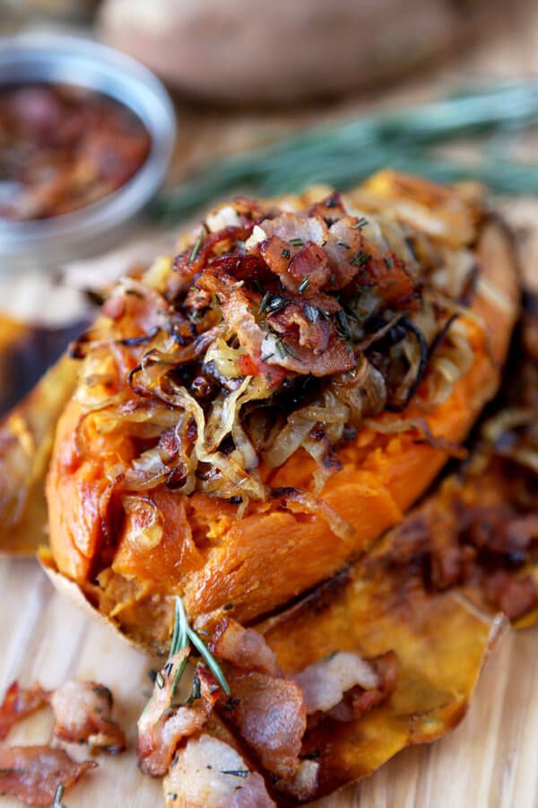 a close up of food on a cutting board with other foods in the back ground