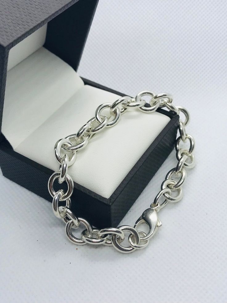 "Vintage silver heavy polished oval link bracelet. It is 7 1/2\" long, 9.88mm thick and weighs 27 grams. It is stamped '925' on the large lobster claw clasp. It's polished like new.  All items are shipped in a pouch in a box with free gift packaging." Sterling Silver Bracelets With Chunky Chain In Oval Link, Chunky Oval Link Silver Chain Bracelet, Classic Sterling Silver Hallmarked Oval Link Bracelet, Classic Hallmarked Sterling Silver Oval Link Bracelet, Vintage Sterling Silver Oval Link Bracelet, Hook Bracelet, Rose Bracelet, Silver Chain Style, Silver Dragon