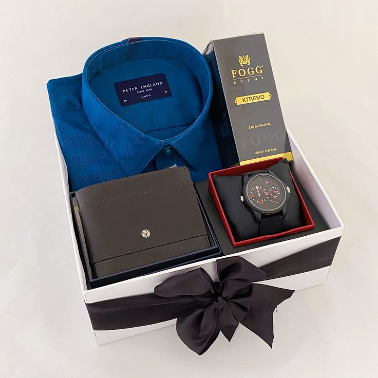 a watch, wallet and tie in a gift box with a blue shirt on it