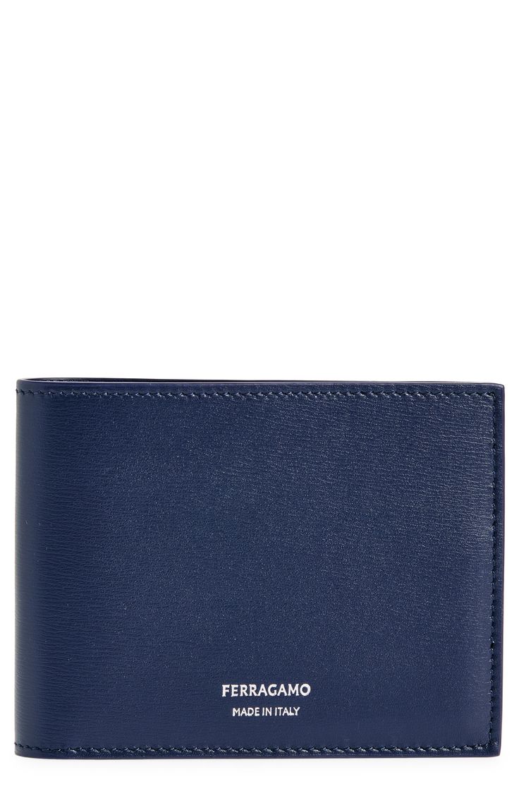 Clean-lined foil lettering subtly brands this Italian-crafted bifold wallet made from durable vegetable-tanned palmellato calfskin. Interior currency pocket; slip pockets; six card slots Leather Made in Italy Formal Leather Wallets With Embossed Logo, Formal Bifold Wallet With Embossed Logo, Classic Wallets With Embossed Logo, Classic Blue Trifold Wallet, Leather Bifold Wallet With Embossed Logo, Classic Blue Leather Wallet, Classic Blue Leather Wallets, Luxury Bifold Wallet With Embossed Logo, Rollerball Perfume