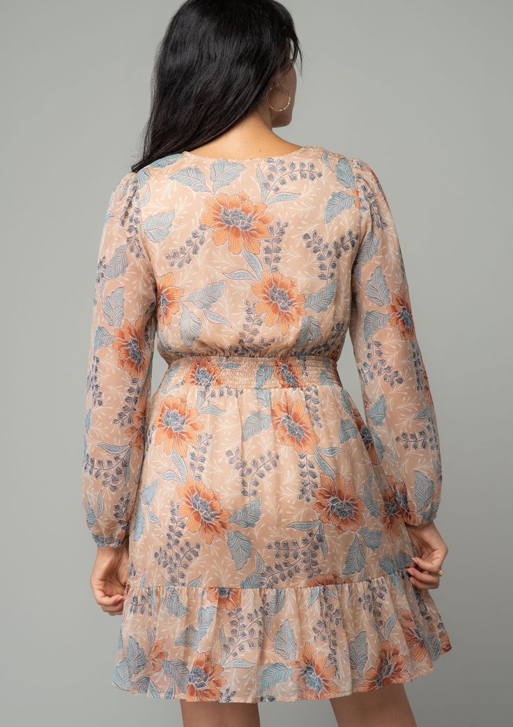 Short and sweet! This ultra-pretty mini dress is designed in a delicate floral print featuring voluminous long sleeves, a flirty surplice v-neckline, and a smocked elastic waist for added definition. Pair this ethereal, ultra-sweet style with a sandal for summer, or warm it up with a knee boot for fall. This versatile mini is a must-have style for any time of year! FINAL SALE Floral print Chiffon Relaxed fit Long volume sleeve Elastic wrist cuff Mini length Tiered skirt Faux wrap skirt Surplice Spring Floral V-neck Dress With Smocked Back, Spring V-neck Dress With Blouson Sleeves, Feminine Long Sleeve Mini Dress With Smocked Bodice, Spring V-neck Mini Dress With Blouson Sleeves, Pretty Mini Dresses, Bohemian Mini Dress, Faux Wrap Skirt, Chiffon Mini Dress, Floral Print Chiffon