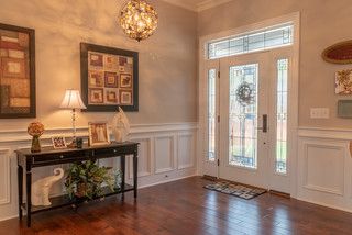 the entryway is clean and ready for us to use as an office or family room