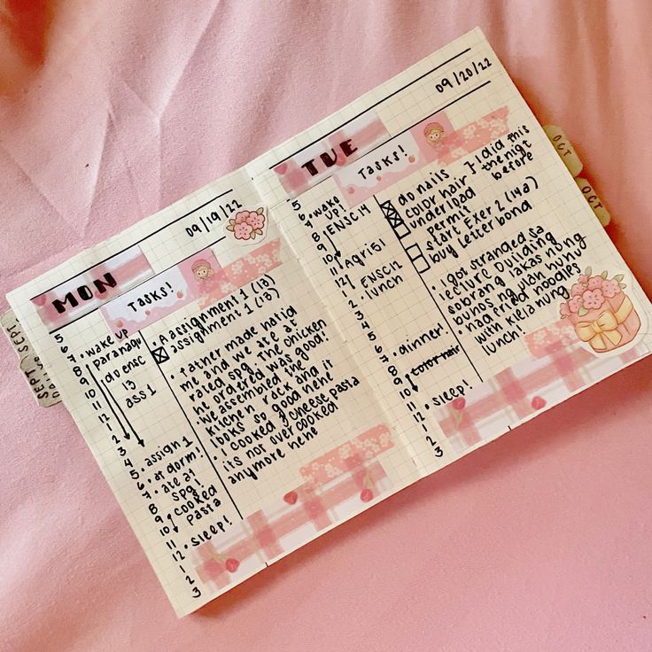 a pink ticket sitting on top of a bed