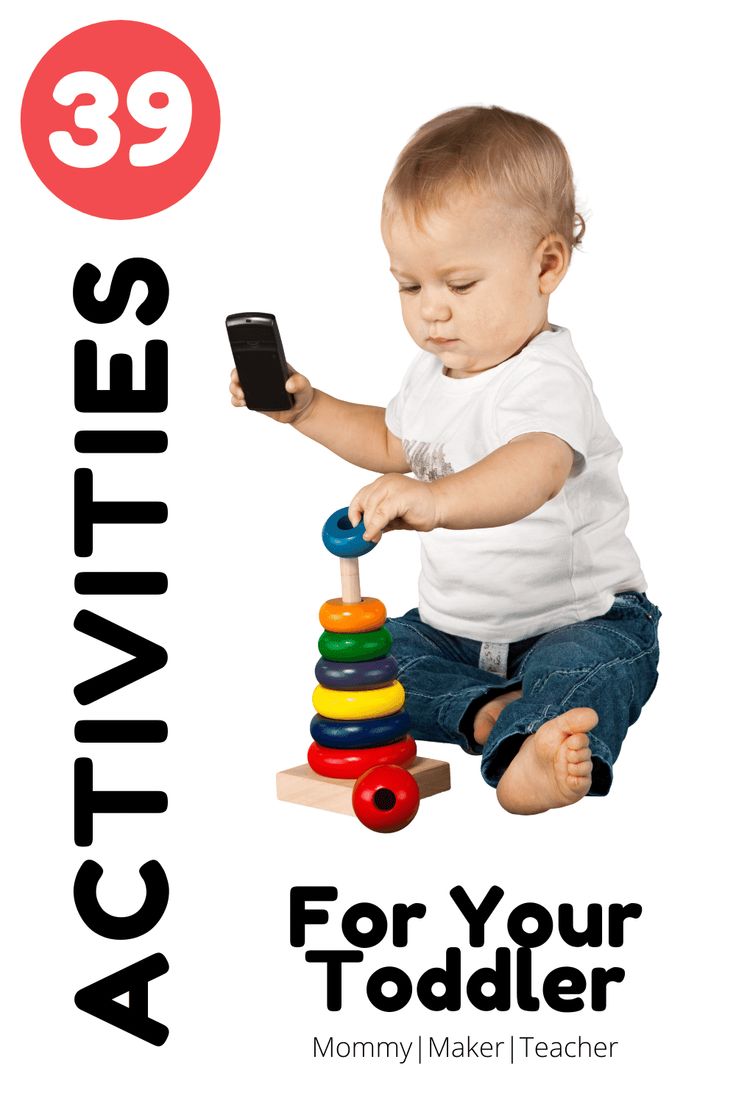 a baby sitting on the ground playing with a toy and text reading activities for your todder