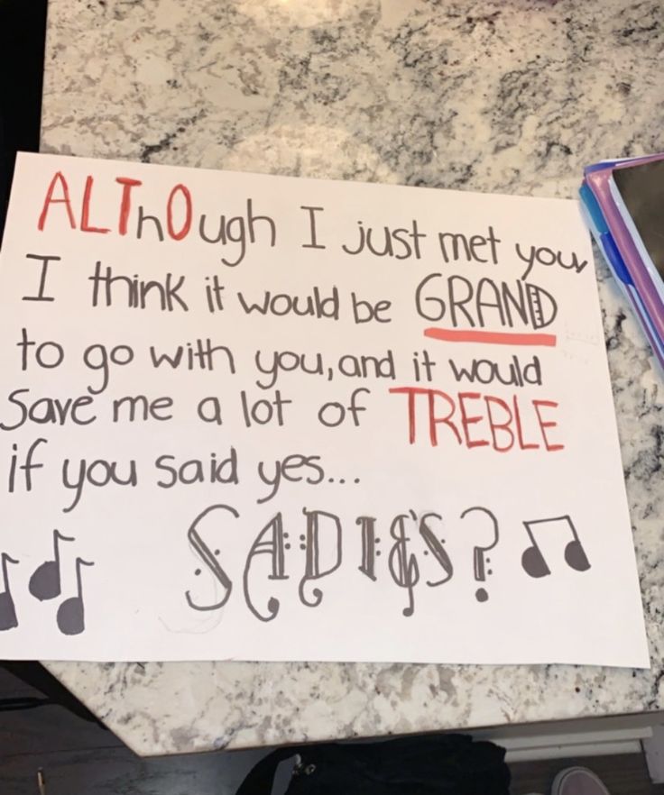 a note written on a marble counter with notes attached to it and a cell phone next to it