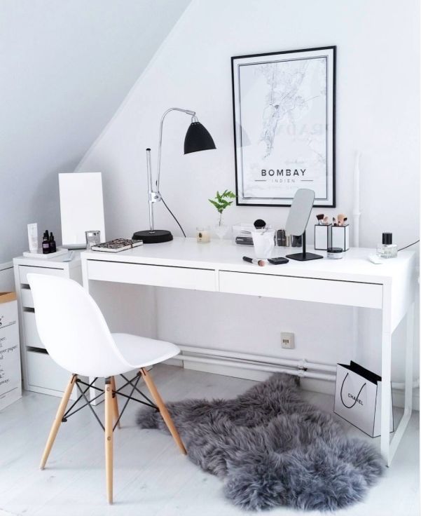 a white desk and chair in a room