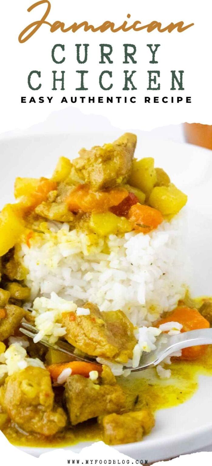 a white plate topped with rice covered in curry chicken and veggies next to a fork