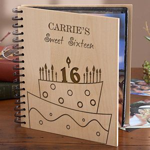 a personalized wooden notebook with a birthday cake on the front and candles in the middle