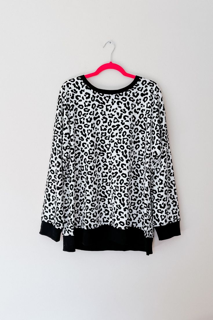 Stay cozy and wild in this Cheetah Print Jersey Knit Pullover Sweatshirt! The classic design - with a contrast neckline and cuffs - makes this a timeless addition to your wardrobe. Layer it with your favorite cold weather looks and express your wild side! Jersey Knit Crew Neckline Banded Cuff Side Slits Relaxed Fit 95% Polyester, 5% Elastane True to Size >> Approximate Measurements << S: Chest 40" Length 25"M: Chest 42" Length 26"L: Chest 44" Length 27"XL: Chest 46" Length 28"2XL: Chest 49" Length 29"3XL: Chest 52" Length 30" Model Sarah Measurements: 5’ 4”, Bust 34", Waist 24", Hips 34" Typically wears a size Small & 0. Wearing a size S here. Model Kylie Measurements: 5’ 5”, Bust 48", Waist 42", Hips 54" Typically wears a size 2XL & size 16W. Wearing a size 2XL here. Traci (that’s me with Leopard Print Long Sleeve Sweater, Trendy Leopard Print Crew Neck Sweater, Oversized Casual Leopard Print Sweater, Leopard Print Crew Neck Top For Winter, Casual Leopard Print Long Sleeve Sweater, Casual Long Sleeve Leopard Print Sweater, Oversized Leopard Print Tops With Long Sleeves, Dress Layer, Swimwear Sets