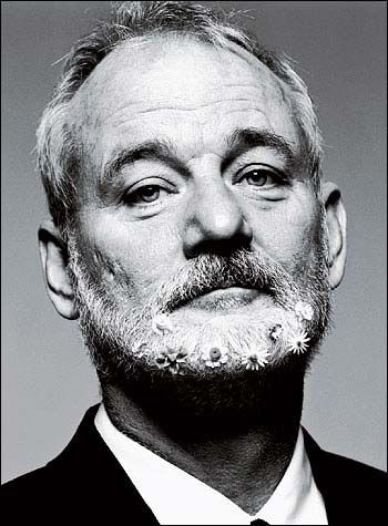 an older man with a beard wearing a suit and tie