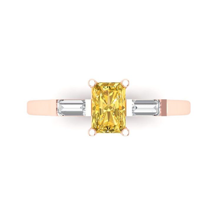 a yellow diamond ring with two baguets on the sides and an accent band