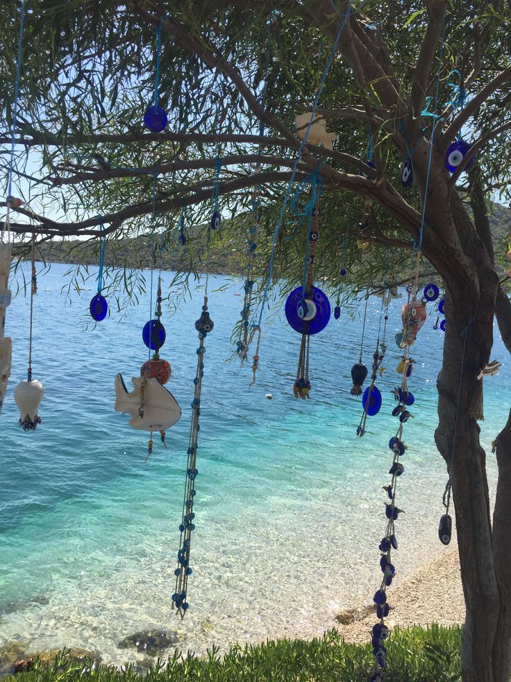 there is a tree that has been decorated with beads and other things hanging from it