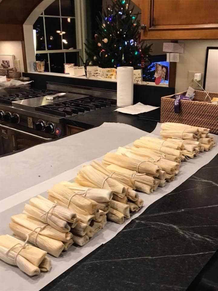 several pieces of food are laid out on a counter in front of a christmas tree