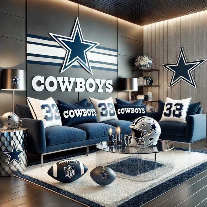 a living room filled with blue couches and football pillows on top of a rug