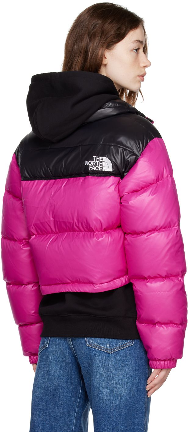 Down-filled quilted nylon ripstop jacket. �· Stand collar · Zip closure · Logo patch at front and back · Zip pockets · Bungee-style drawstring at hem · Adjustable velcro straps at cuffs · Full taffeta lining Supplier color: Fuchsia pink Fill: 85% waterfowl down, 15% waterfowl feathers. Nuptse Short Jacket, The North Face Jacke, Pink North Face Jacket, The North Face 1996 Retro Nuptse, North Face Outfits, Retro Nuptse Jacket, Down Winter Coats, North Face Nuptse, North Face Shorts