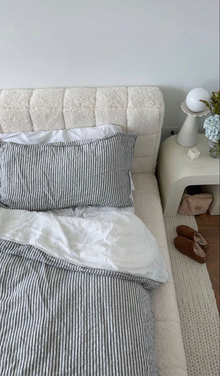 a bed with two pillows on top of it