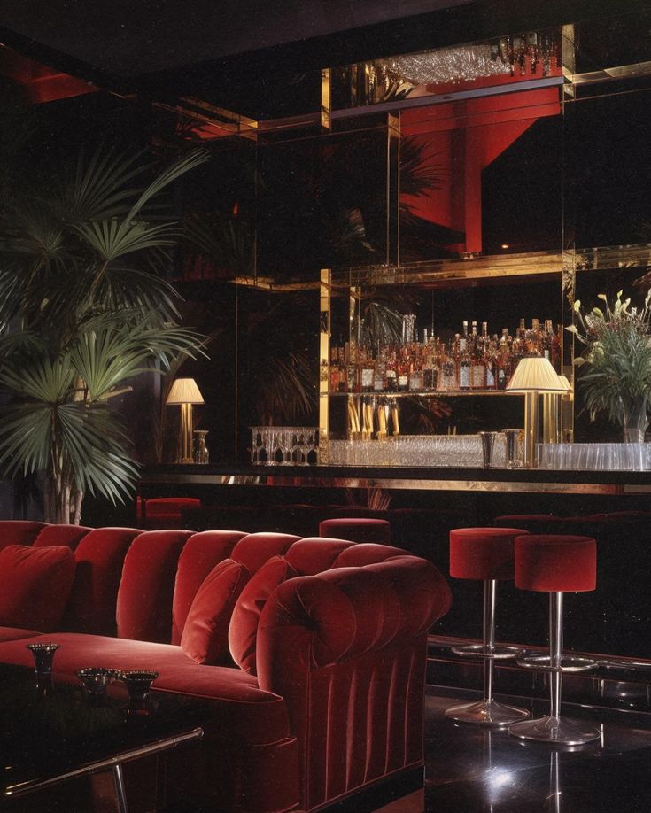 a red couch sitting in front of a bar