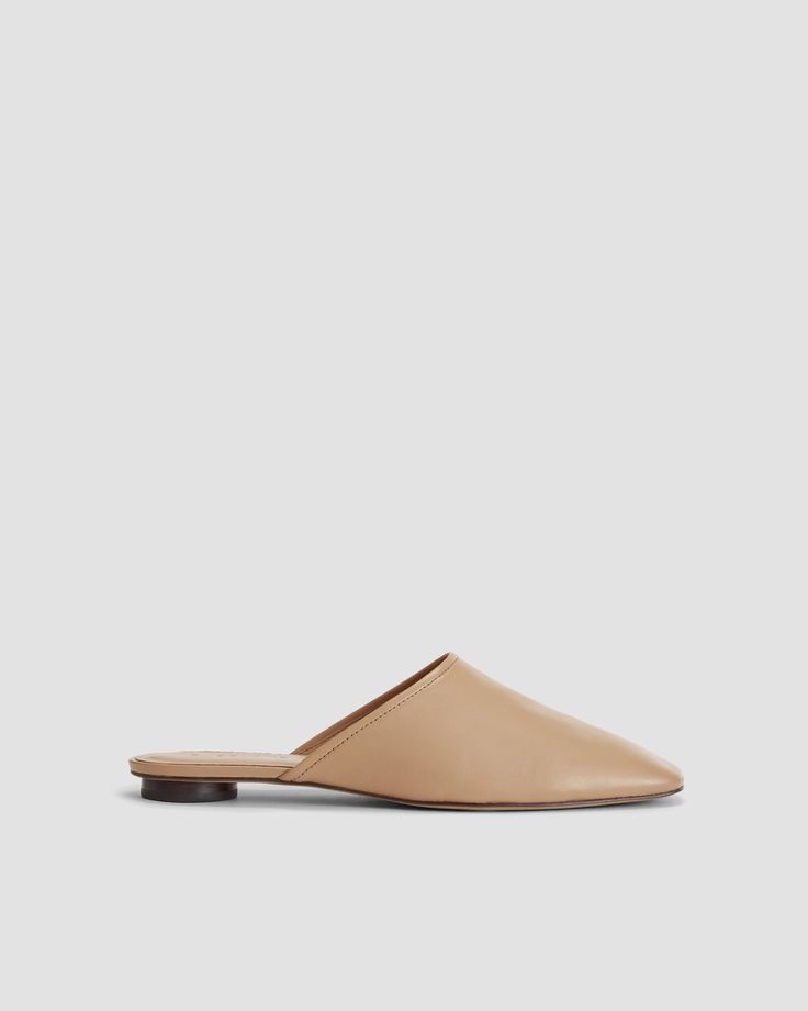 Classic Closed Toe Mules For Everyday, Modern Everyday Mules With Leather Sole, Leather Footbed Slip-on Mules For Everyday, Calf Leather Almond Toe Slip-on Mules, Calf Leather Almond Toe Mules, Everyday Slip-on Flat Heel Mules, Everyday Slip-on Mules With Flat Heel, Everyday Flat Heel Slip-on Mules, Classic Flat Mules With Leather Lining