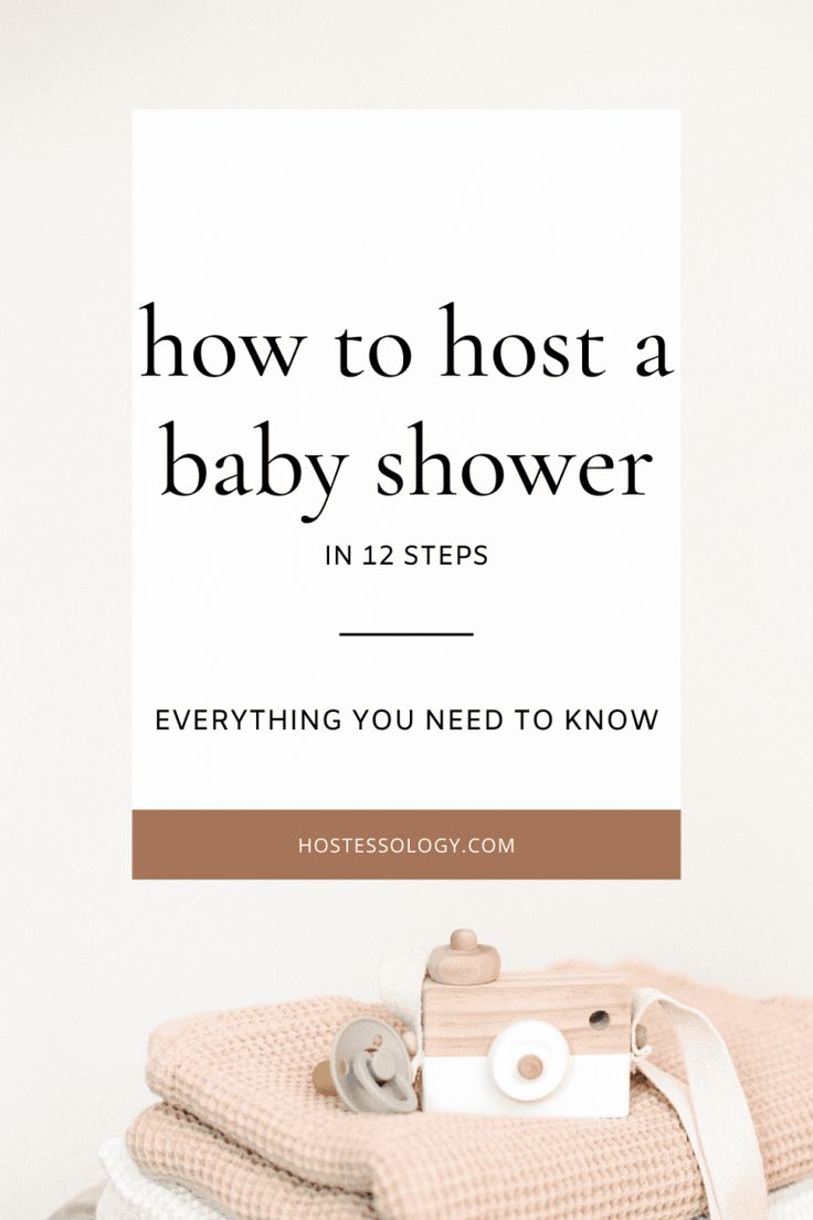 a stack of folded towels with the words how to host a baby shower in 12 steps