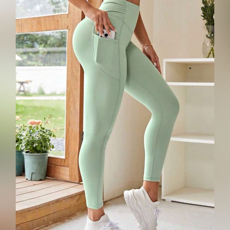 Wide Waistband Phone Pocket Side Sports Leggings Color:Mint Green High Waisted Slight Stretch Cropped Gym And Outdoors Sports Yoga Basic Measurements: Length:35.8” Inseam:25.6” Waist:24.4-39.4” Hip:32.3” Thigh:19.6” Solid Yoga Pants With Side Pockets For Sports, Solid Color Yoga Pants With Side Pockets For Sports, Solid Color Sports Yoga Pants With Side Pockets, Yoga Pants With Side Pockets For Gym, Sporty Solid Yoga Pants With Side Pockets, Solid Color Activewear With Pockets For Workout, Green Activewear With Side Pockets For Sports, Activewear With Pockets For Running, Activewear With Pockets For Jogging