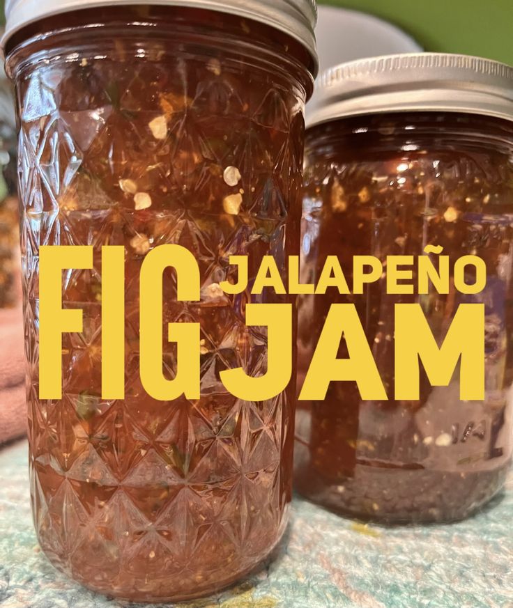 two jars filled with food sitting on top of a table next to each other and the words jalapeno fig jam