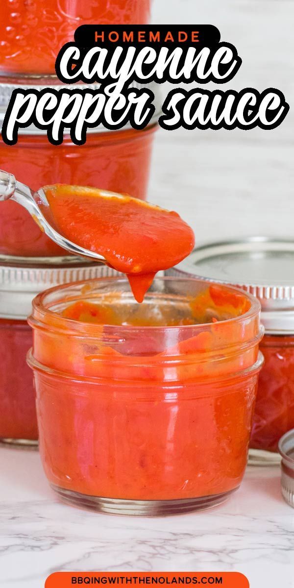 homemade cayenne pepper sauce in a jar with a spoon