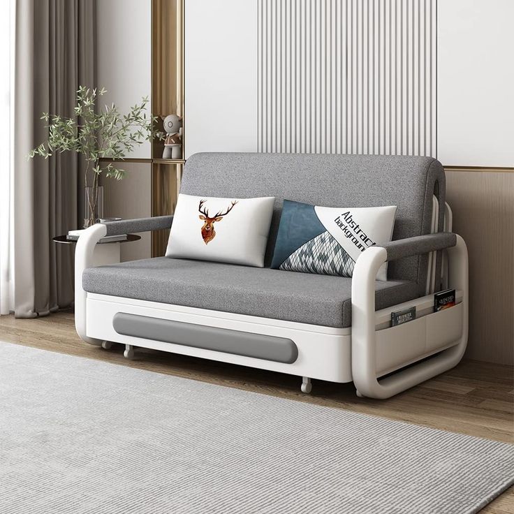 a living room with a gray couch and white rug on the floor next to a window