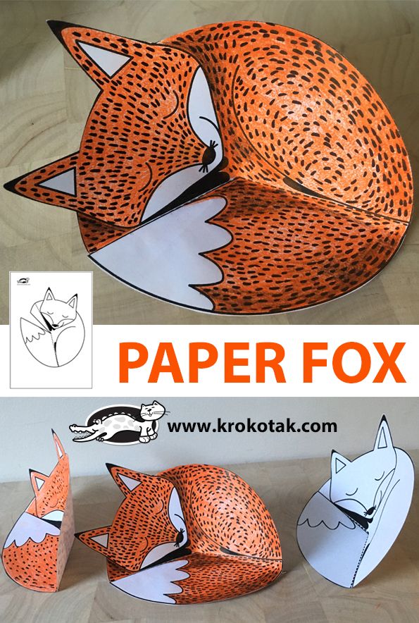 the paper fox is laying down on the floor