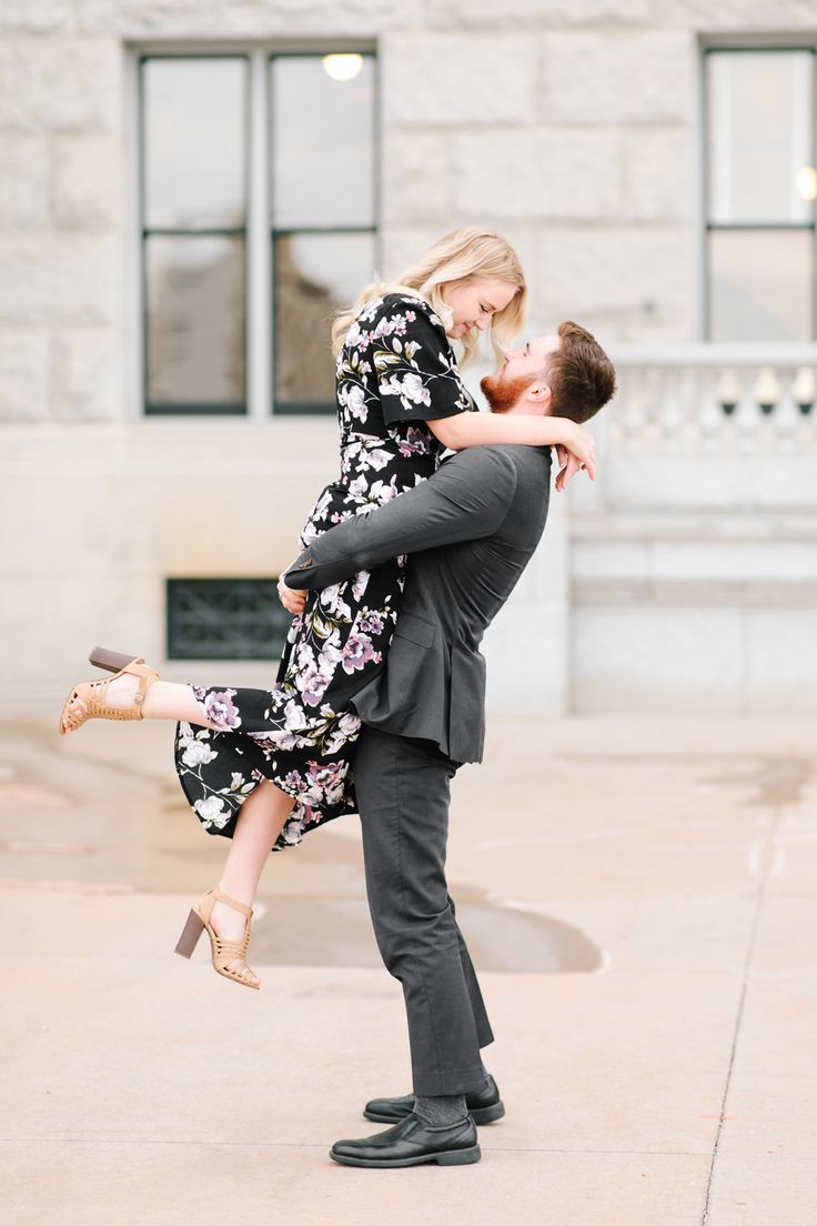 a man holding a woman in his arms