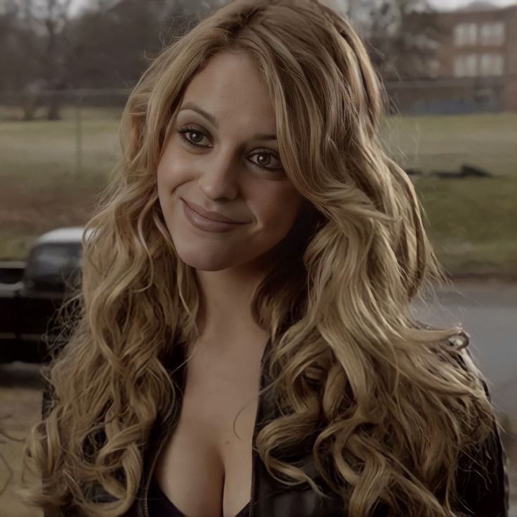 a close up of a person with long hair