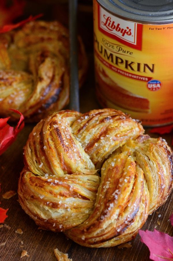 some kind of pastry sitting on top of a wooden table next to a can of pumpkin