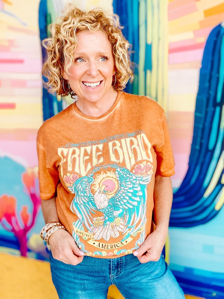 Free Bird Graphic Tee 1987-Orange Bright Tee Fun Tee Free Bird Graphic Tee Rocker Vintage feel Stone washed Distressed Look Relaxed Fit Tessa wears the Small 100% Cotton Wash Cold Lay Flat or Hang to Dry