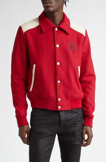 Iconic collegiate garb gets the LA brand's signature updating for this prefall '24 varsity jacket that remixes the tradtional wool-and-leather combination. A tonally embroidered monogram logo marks the chest. Front snap closure Spread collar Front zip-welt pockets Ribbed cuffs and hem Lined 100% wool with leather contrast Dry clean Made in Italy Designer Clothing Long Sleeve Varsity Jacket With Logo Detail For Winter, Varsity Jacket With Logo Detail, Winter College Varsity Jacket With Logo Detail, College Varsity Jacket With Logo For Winter, Winter Varsity Jacket With Logo Detail, Winter Varsity Jacket With Logo And Baseball Collar, Fall Streetwear Varsity Jacket With Logo Detail, Fall Varsity Jacket With Logo For Streetwear, Designer Long Sleeve Varsity Jacket With Embroidered Logo