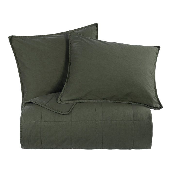 two green pillows on top of each other