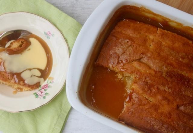 a plate with some food on it next to a casserole dish filled with pudding