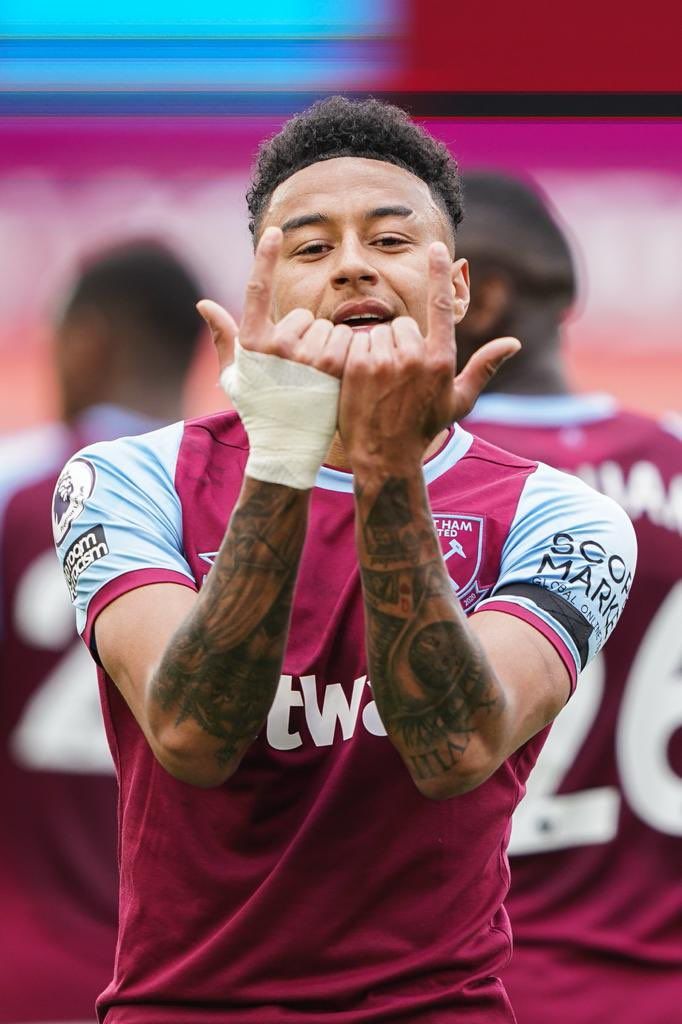 a soccer player with his hands in the air