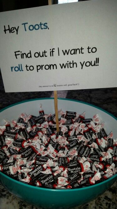 a bowl full of candy and a sign that says they toots find out if i want to roll to prom with you