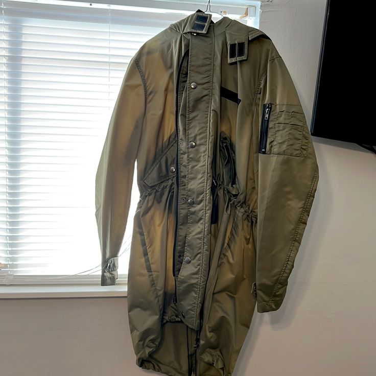 Olive Green Never Worn In Great Condition Asos Jacket Spring Long Coat Parka With Pockets, Olive Utility Winter Outerwear, Olive Utility Outerwear For Winter, Olive Hooded Utility Outerwear, Olive Utility Outerwear For Fall, Olive Military Outerwear For Cold Weather, Military Style Olive Outerwear For Cold Weather, Khaki Long Sleeve Utility Parka, Khaki Utility Outerwear For Fall