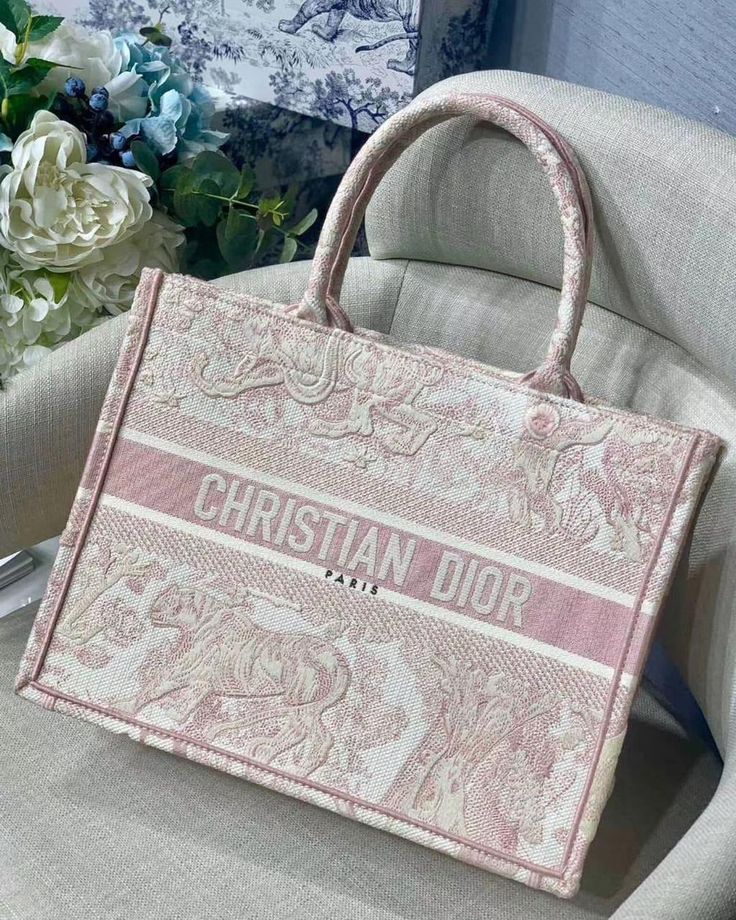 Size:?ÿ 35 cm,?ÿ 40 cm Include : Fast Shipping 5 to 7 days delivery Free delivery worldwide at your doorstep Complete box packaging ?ÿWhatsApp?ÿfor order or info The Dior tote is a flagship accessory to the House of Dior, and has been coveted for generations. The Dior tote bag embodies functionality and elegance, as itƒ??s designed to carry all of your essentials and be used for all your everyday needs. The iconic Dior book tote is embroidered with ƒ??CHRISTIAN DIORƒ?? on the front, and can be c Dior Tote Bag, Dior Purse, House Of Dior, Luxury Bags Collection, Dior Book Tote, Girly Bags, Designer Totes, Fancy Bags, Pretty Bags