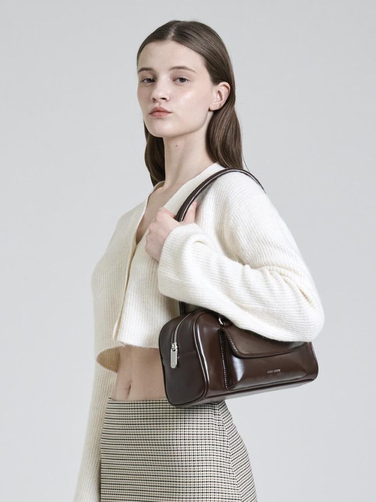 Editor's NotesEasy and stylish bags that go well with everyone- Rectangular silhouette shoulder bag- Practical flap pocket at front- High quality material that has natural gloss- Top zipper fastening- Inside zipped pocketMeasurements (in.).- W x H x D: 9.8 in. × 5.9 in. × 4.3in.- Strap height 6.9 in.- Weight 430gComposition & Care- Vegan leather, 100% polyester- Do not washDesigner- by occur source Modern Satchel Baguette Bag With Zipper, Modern Satchel With Zipper Pocket, Modern Box Bag With Zipper Closure, Modern Shoulder Bag With Zipper Pocket For Fall, Modern Rectangular Baguette Bag With Zipper Pocket, Modern Rectangular Baguette Bag With Zipper, Modern Rectangular Baguette Bag, Modern Shoulder Bag With Zipper Closure For Fall, Modern Shoulder Bag With Zipper For Fall