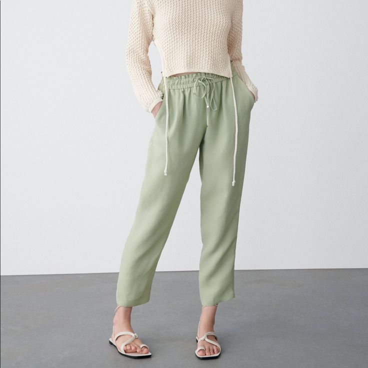 High-Waist Trousers With An Elastic Waistband And An Adjustable Drawstring. Front Pockets, Decorative Welt Pocket At The Back. Light Khaki . Full Waist 26” And Beyond.Length 38” Inseam 27” Rise 11” Green Pull-on Straight Pants, Green Tapered Leg Pants With Pull-on Style, Chic Drawstring Bottoms For Spring, Chic Spring Bottoms With Drawstring, Chic Spring Pants With Drawstring, Spring Relaxed Fit Bottoms With Drawstring, Relaxed Fit Drawstring Bottoms For Spring, Drawstring Trousers For Day Out, Green Pull-on Tapered Leg Pants