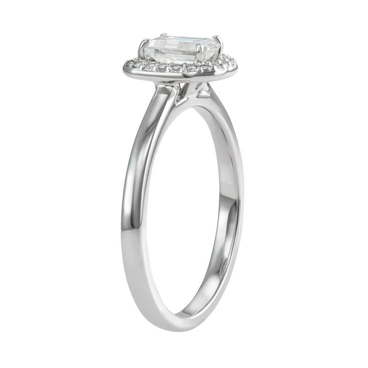 You'll adore the sleek style of this 14k white gold moissanite emerald-cut halo ring. RING DETAILS Width: 9.2 mm. Metal: rhodium-plated 14k white gold Includes: gift box & warranty card By Charles & Colvard  STONE DETAILS Stone type: lab-created moissanite Total weight diamond equivalent: 5/8 ct. Cut:emerald Setting: prong  Diamond equivalent carat (ct.) Total Weight (T.W.) represents the approximate total weight of diamonds of equivalent appearance.Please note, due to the high value of this ite