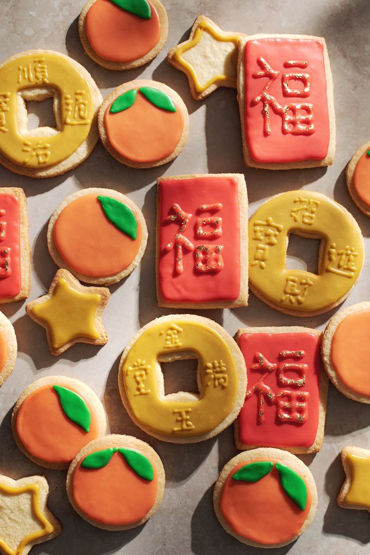 decorated cookies are arranged in the shape of letters and numbers