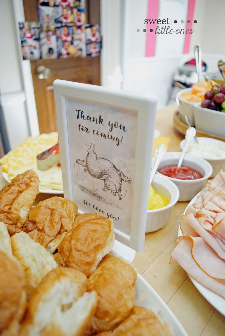 there are many different foods on the table and one has a sign that says thank you for coming